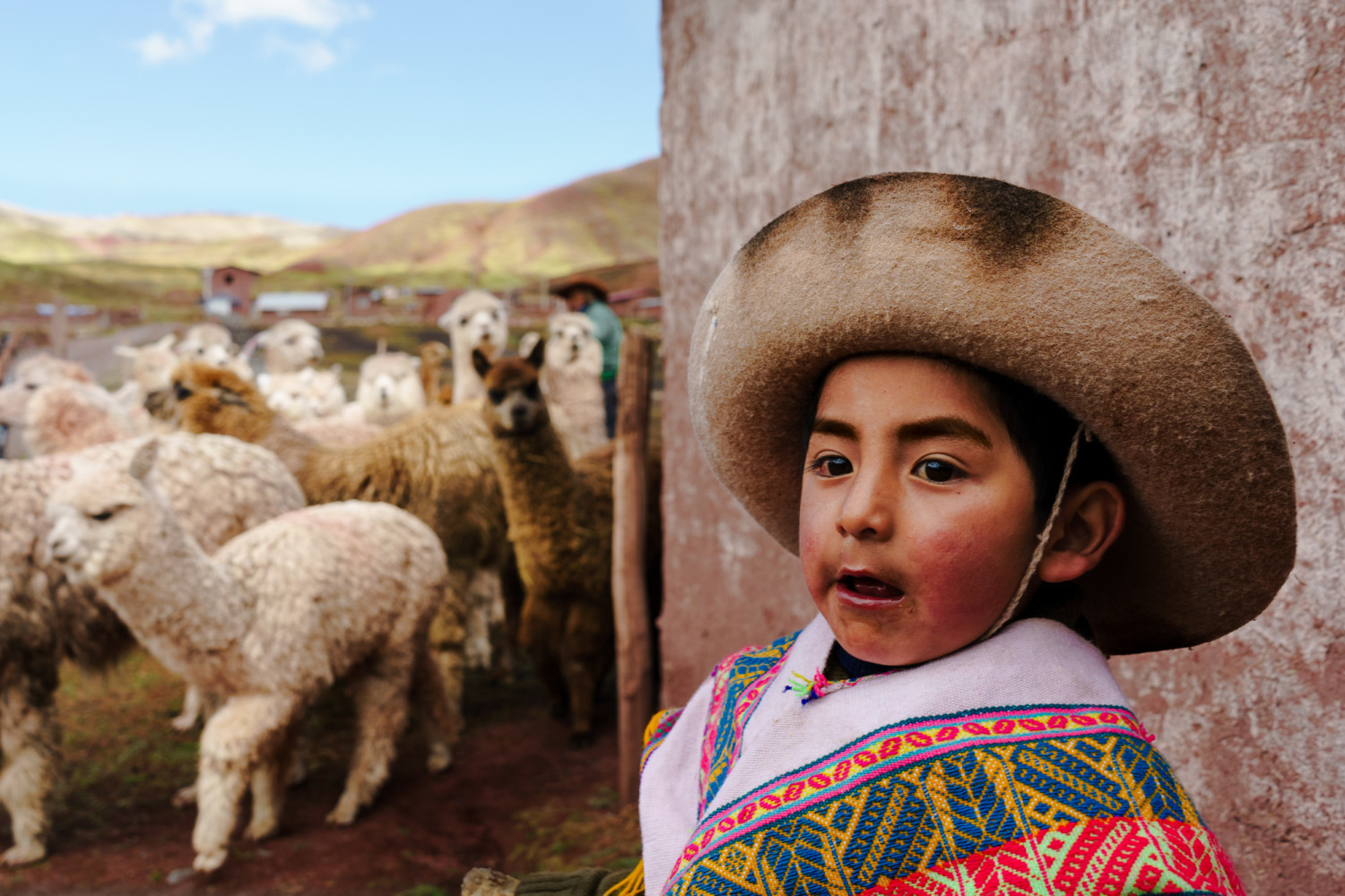A young villager with an oversized hat | Peru Photo Tour with raw.tours