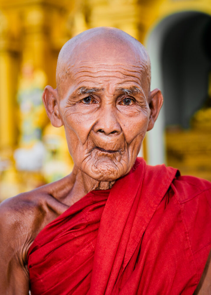 A Monk in from of a temple in Yangon - Tom Bourdon Travel Photography