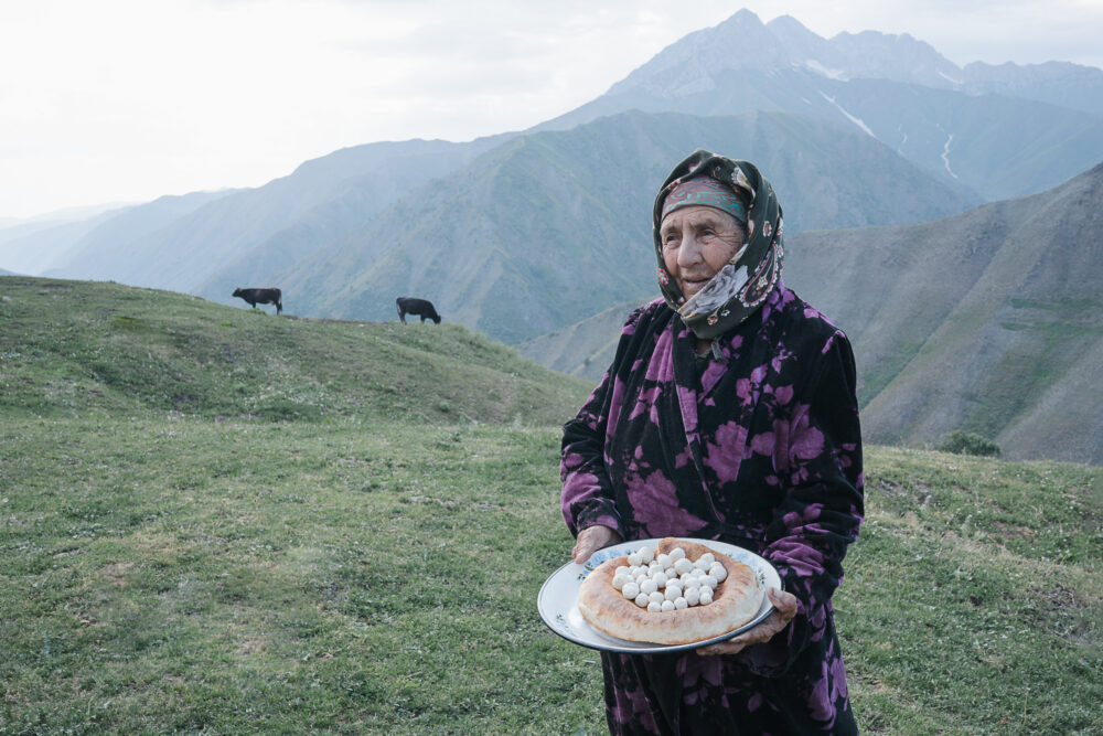 Elder Offering Traditional Snacks